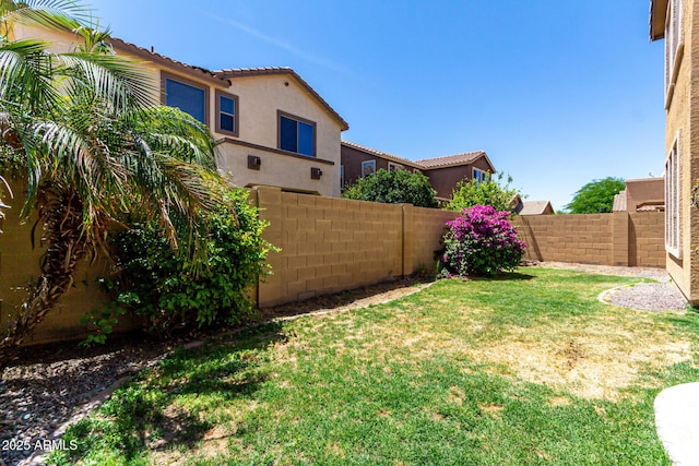 view of yard featuring a fenced backyard