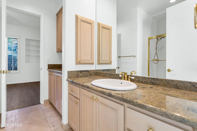 bathroom featuring tile patterned floors and vanity