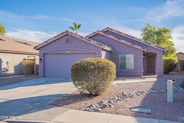 single story home featuring a garage