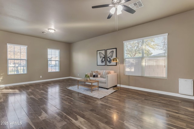 unfurnished room featuring ceiling fan and dark hardwood / wood-style flooring