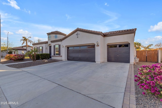 mediterranean / spanish-style home featuring a garage