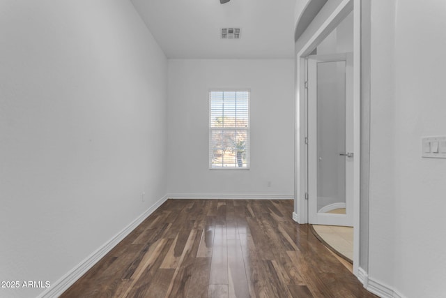 spare room with dark hardwood / wood-style flooring