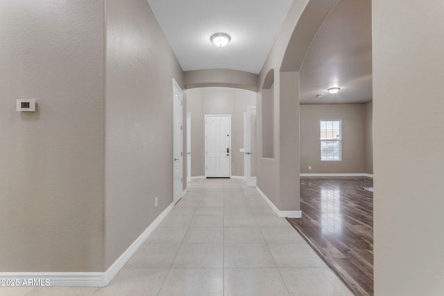 hallway featuring light tile patterned flooring