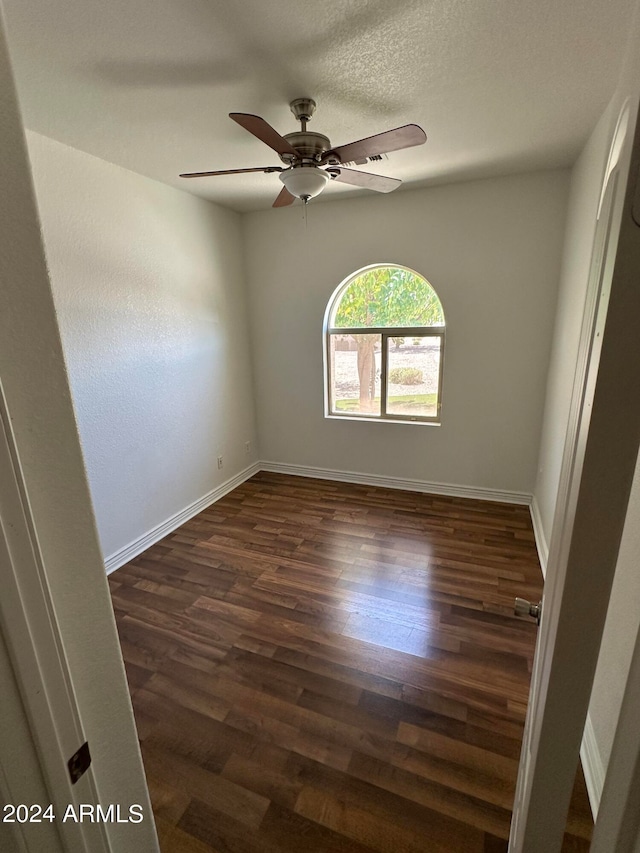 unfurnished room featuring a textured ceiling, ceiling fan, and hardwood / wood-style floors