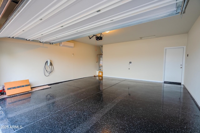 garage with an AC wall unit and a garage door opener