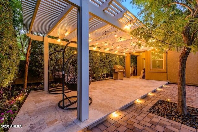 view of patio featuring area for grilling and a pergola