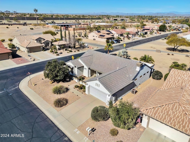 birds eye view of property featuring a mountain view