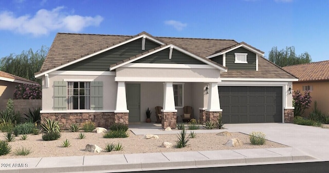 craftsman-style house featuring a garage and a porch