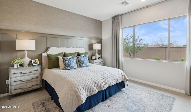 bedroom with light hardwood / wood-style flooring