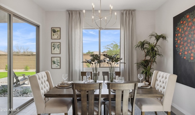 dining space with an inviting chandelier