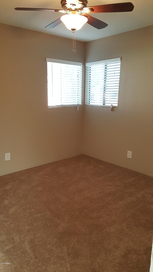 725 E Hidalgo Ave, Phoenix, AZ 85040 - spare room with carpet floors and ceiling fan