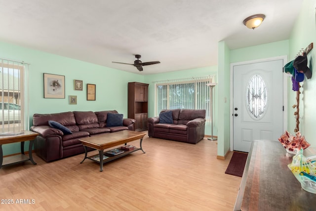 1409 S Revere, Mesa, AZ 85210 - living room featuring healthy amount of natural light, light wood-type flooring, and a ceiling fan