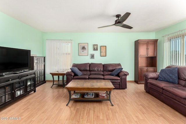 1409 S Revere, Mesa, AZ 85210 - living area with light wood-style flooring, ceiling fan, and baseboards