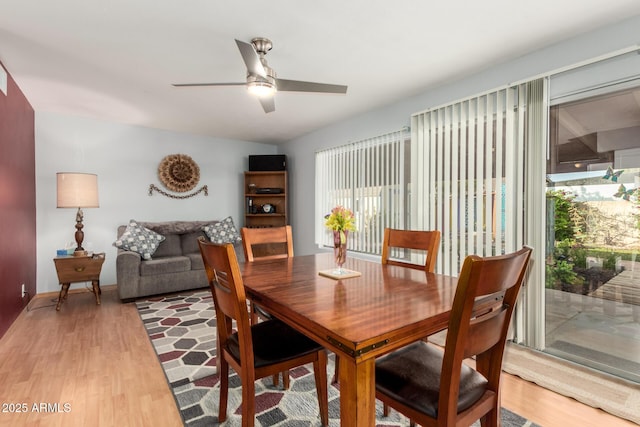 1409 S Revere, Mesa, AZ 85210 - dining space with light wood finished floors, a ceiling fan, and baseboards