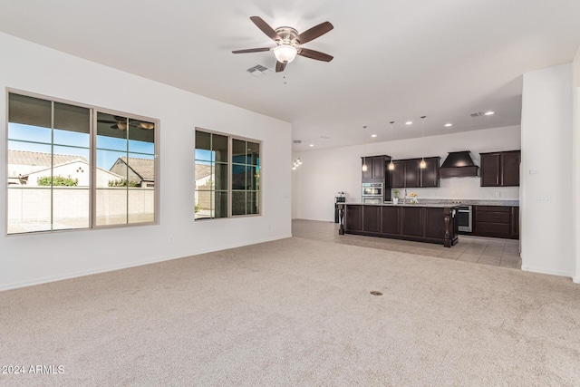 11122 E Tripoli Ave, Mesa, AZ 85212 - unfurnished living room with light colored carpet, a ceiling fan, and recessed lighting