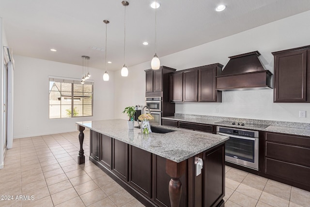 11122 E Tripoli Ave, Mesa, AZ 85212 - kitchen with custom exhaust hood, black electric cooktop, light tile patterned floors, light stone countertops, and dark brown cabinets