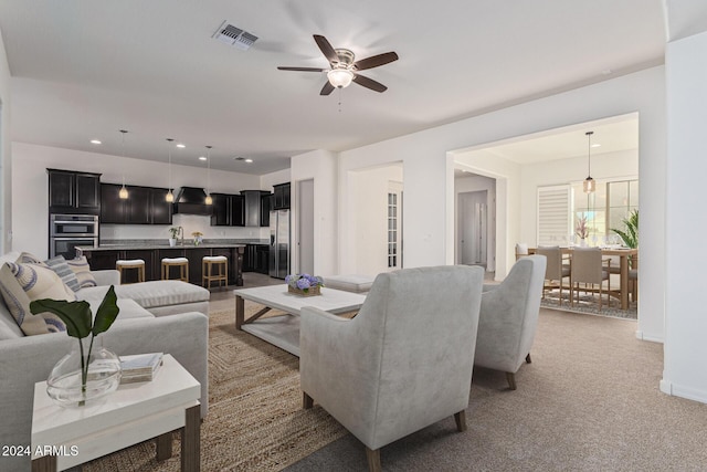 11122 E Tripoli Ave, Mesa, AZ 85212 - living room featuring a ceiling fan, light carpet, and recessed lighting