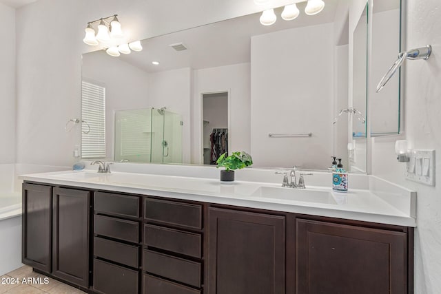 11122 E Tripoli Ave, Mesa, AZ 85212 - bathroom featuring a shower stall, double vanity, and tile patterned floors