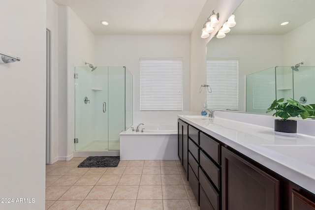 11122 E Tripoli Ave, Mesa, AZ 85212 - bathroom featuring a stall shower, a bath, double vanity, and tile patterned flooring