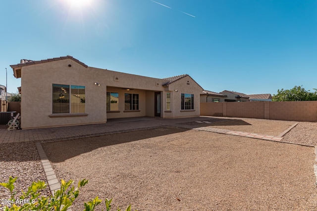 11122 E Tripoli Ave, Mesa, AZ 85212 - rear view of property with stucco siding, a fenced backyard, a patio, and a tiled roof