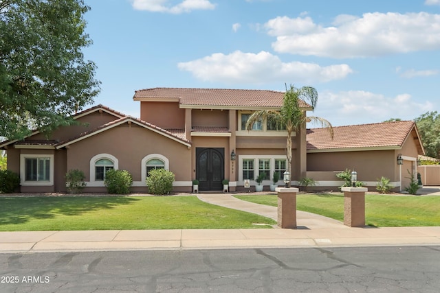 4735 E Harmony Cir, Mesa, AZ 85206 - mediterranean / spanish home featuring a tiled roof, stucco siding, and a front lawn