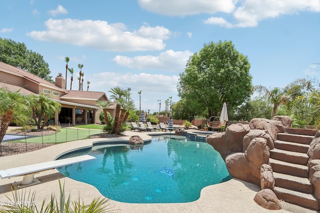4735 E Harmony Cir, Mesa, AZ 85206 - view of swimming pool featuring a diving board, a patio, and a pool with connected hot tub