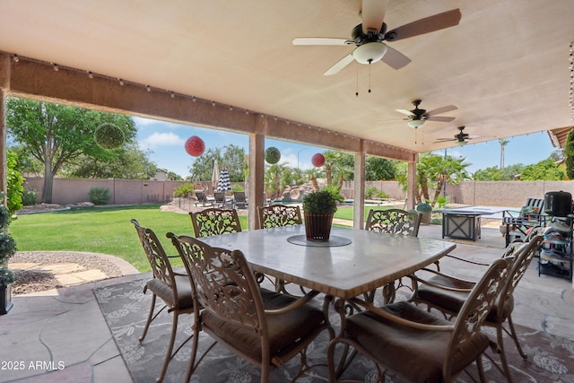 4735 E Harmony Cir, Mesa, AZ 85206 - fenced backyard featuring outdoor dining area, a patio, and a ceiling fan