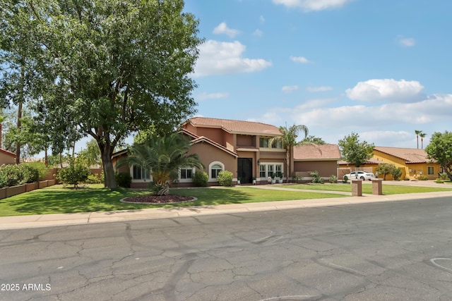 4735 E Harmony Cir, Mesa, AZ 85206 - view of front facade featuring stucco siding, a front lawn, and a tiled roof