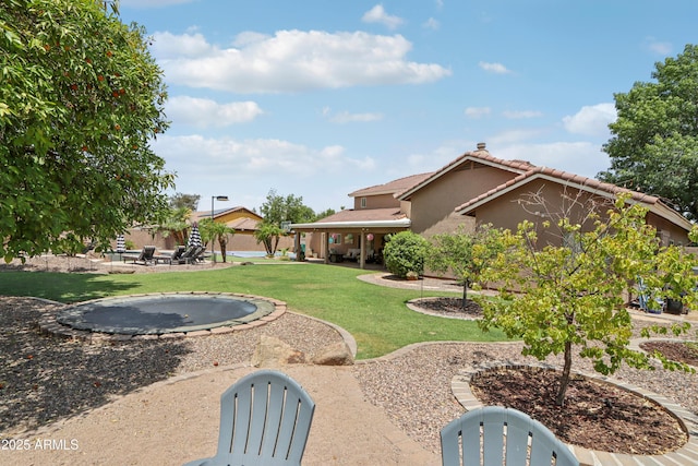 4735 E Harmony Cir, Mesa, AZ 85206 - view of green lawn featuring a patio