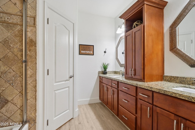 4735 E Harmony Cir, Mesa, AZ 85206 - full bath with double vanity, a tile shower, and wood finished floors