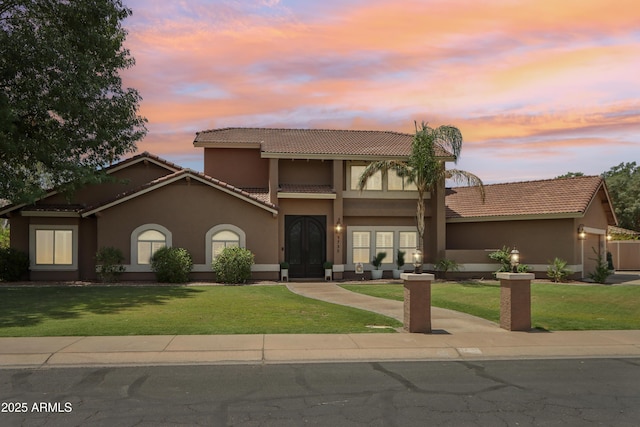 4735 E Harmony Cir, Mesa, AZ 85206 - view of front facade with a tiled roof, stucco siding, and a front lawn