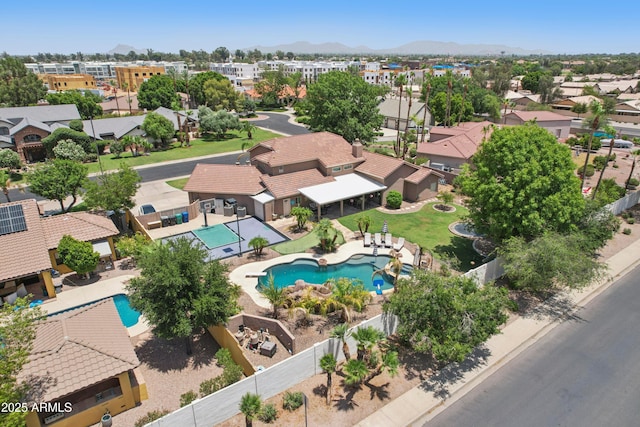 4735 E Harmony Cir, Mesa, AZ 85206 - aerial view of residential area featuring a pool and a mountainous background