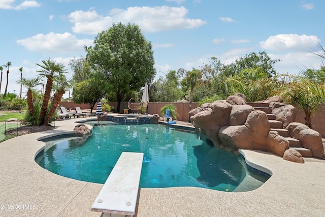 4735 E Harmony Cir, Mesa, AZ 85206 - view of swimming pool featuring a patio area, a diving board, and a pool with connected hot tub