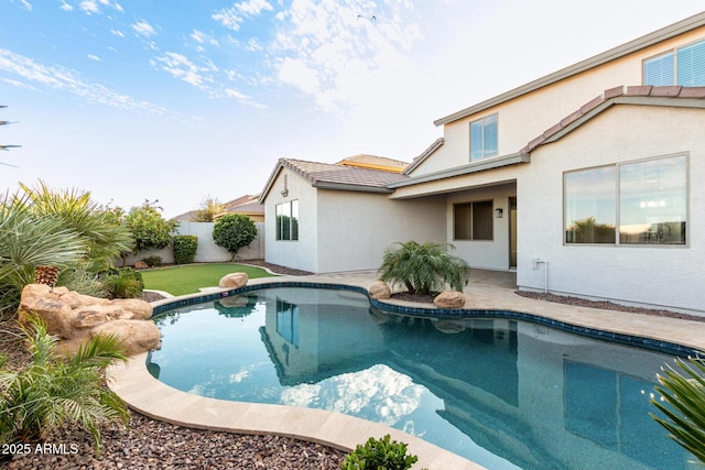 view of swimming pool with a patio area and a fenced backyard