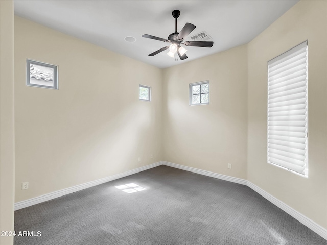 unfurnished room featuring ceiling fan and carpet flooring