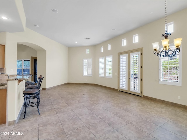 interior space with sink and a notable chandelier