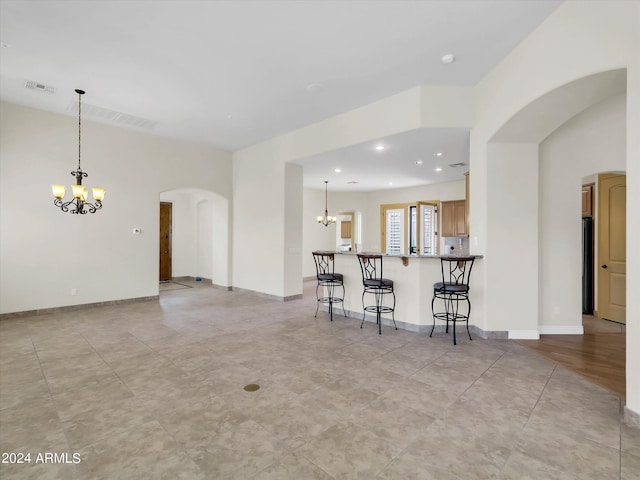 living room with an inviting chandelier