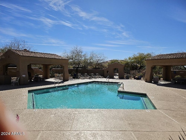 view of swimming pool featuring a patio