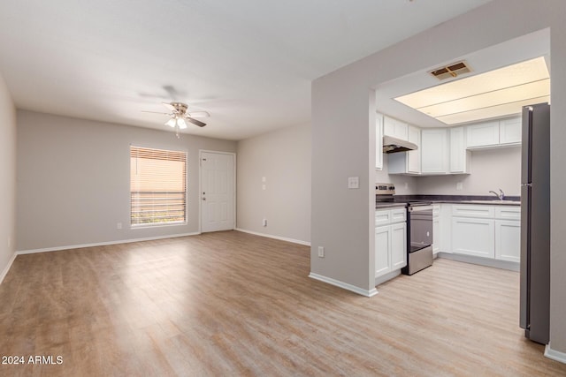 kitchen featuring ceiling fan, range hood, light hardwood / wood-style floors, white cabinets, and appliances with stainless steel finishes