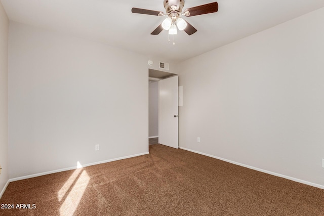 empty room featuring carpet and ceiling fan