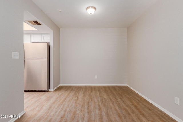 spare room featuring light hardwood / wood-style floors