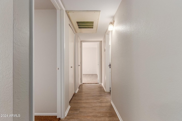 corridor featuring hardwood / wood-style floors