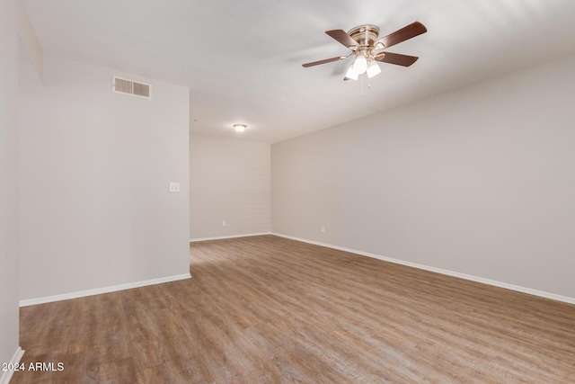 spare room with ceiling fan and light hardwood / wood-style floors