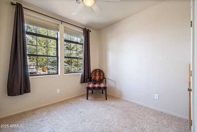 unfurnished room featuring baseboards, carpet floors, and ceiling fan
