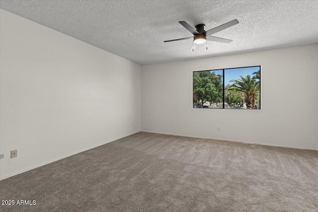 unfurnished room featuring a textured ceiling, ceiling fan, baseboards, and carpet flooring