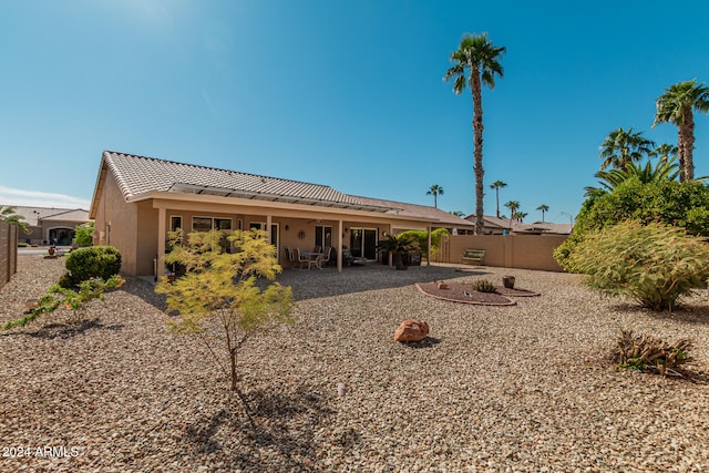 back of property featuring a patio