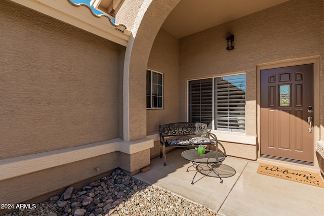 doorway to property with a porch