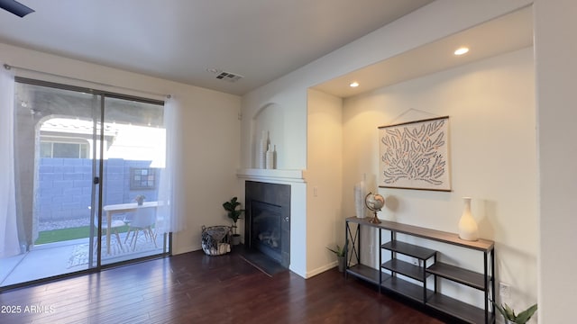 living room with dark hardwood / wood-style flooring