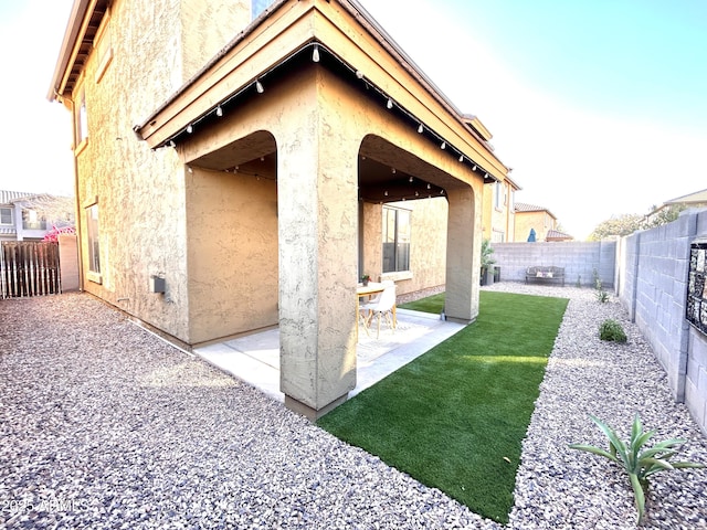 back of house with a patio