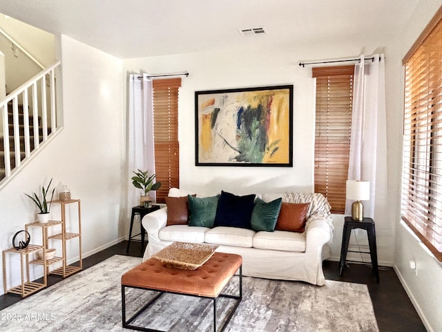 living room featuring dark wood-type flooring